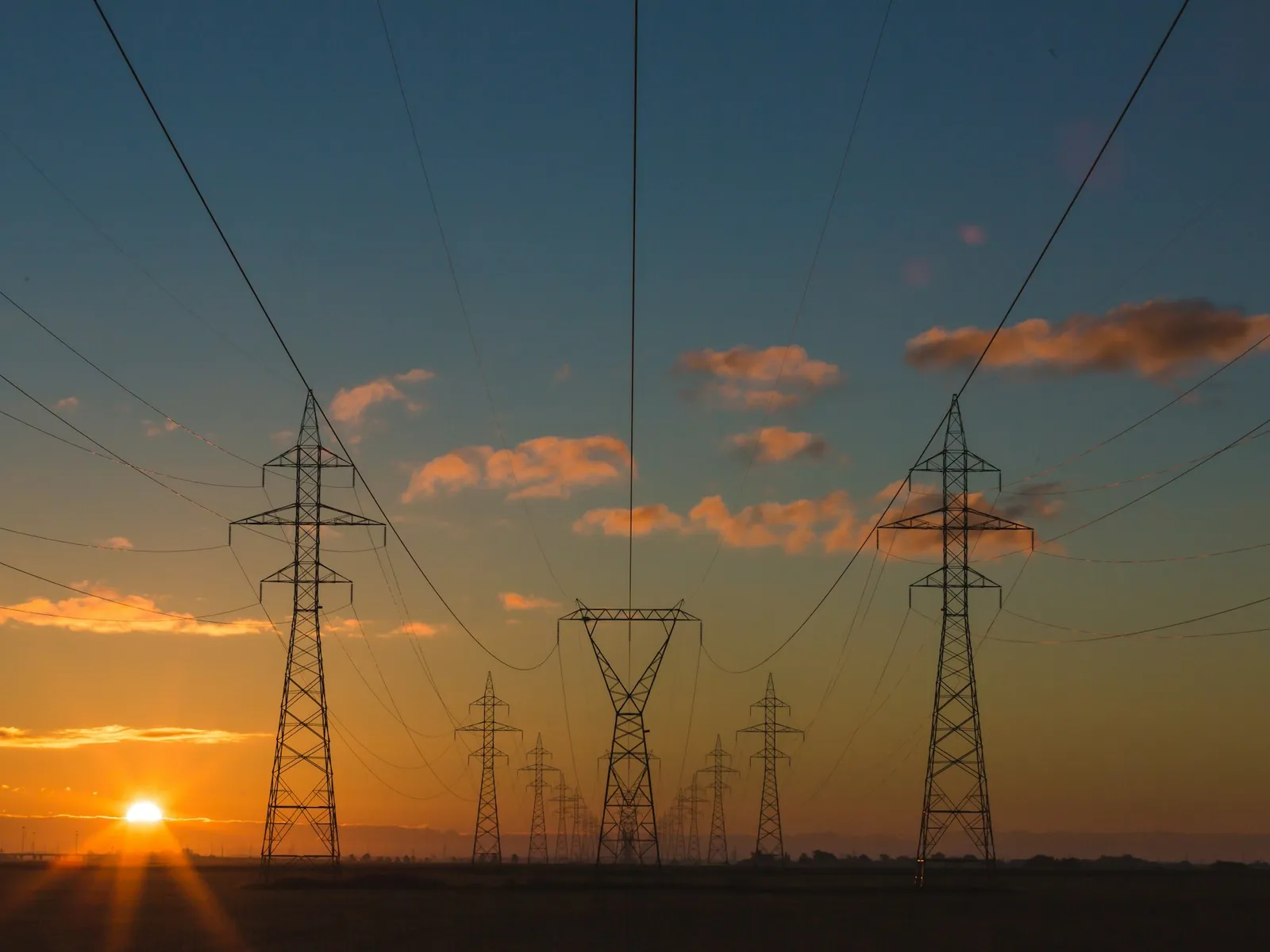 Transmission towers at sunset