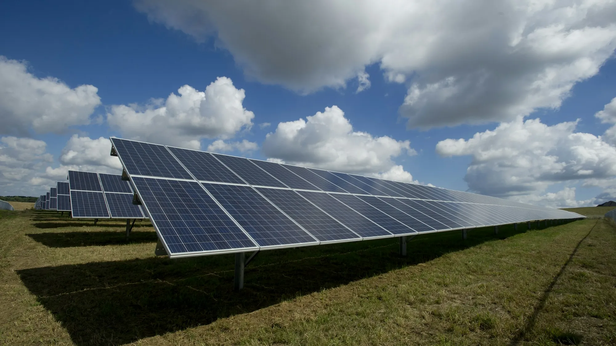 Solar panels in a wide coastal landscape