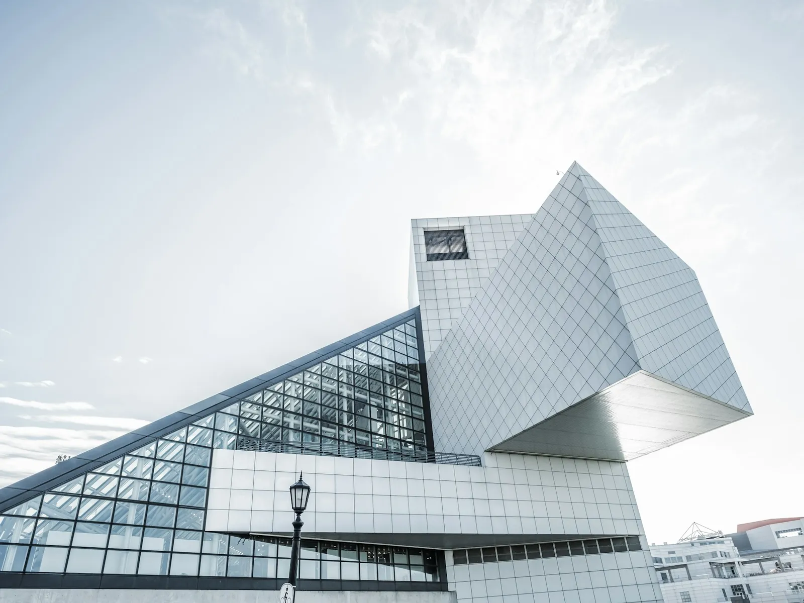 White geometric school building against a clear sky