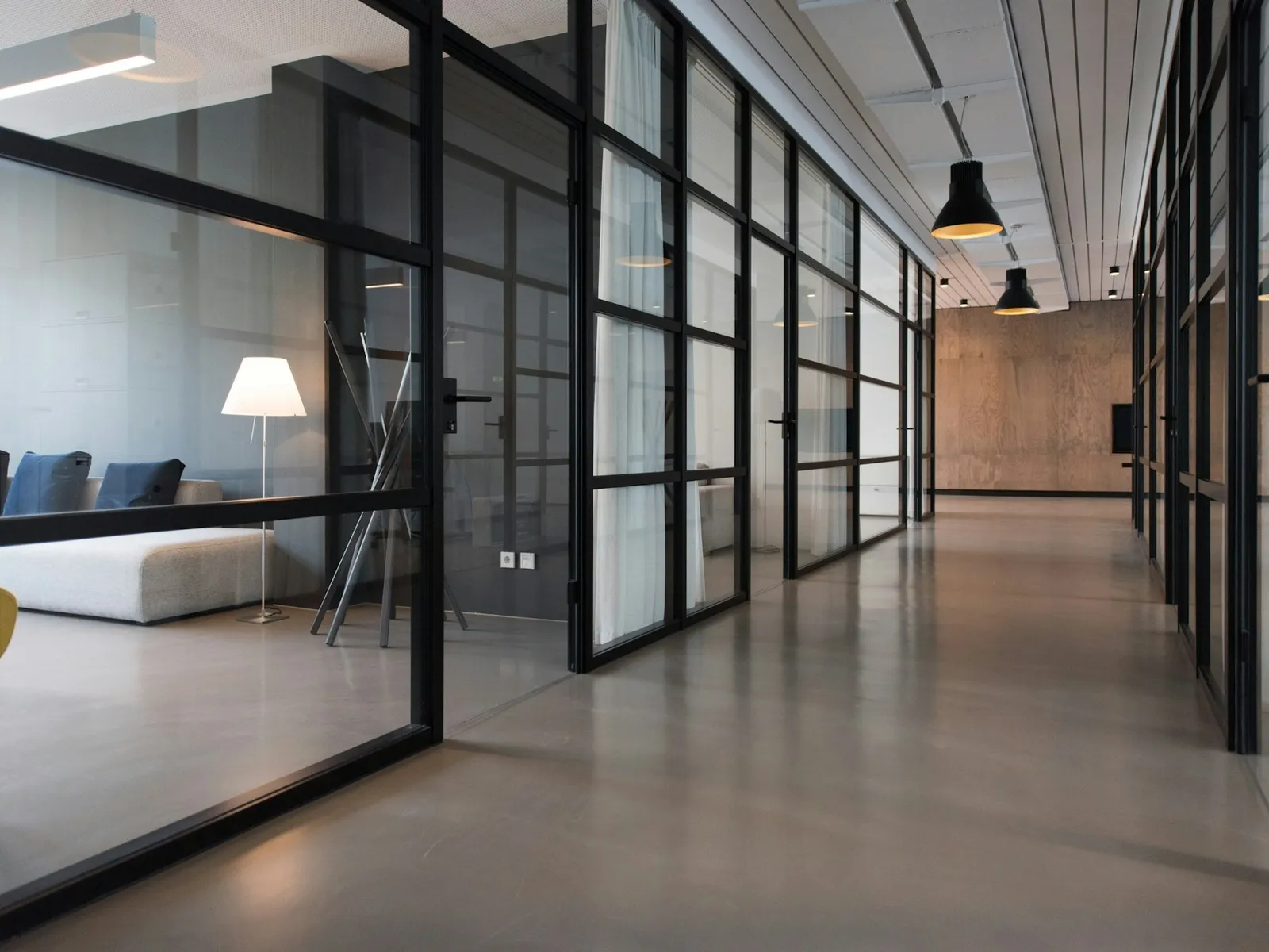 Quiet studio interior with long tables and daylight