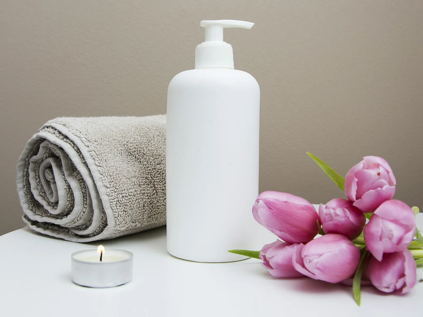 Spa products arranged on a stone surface